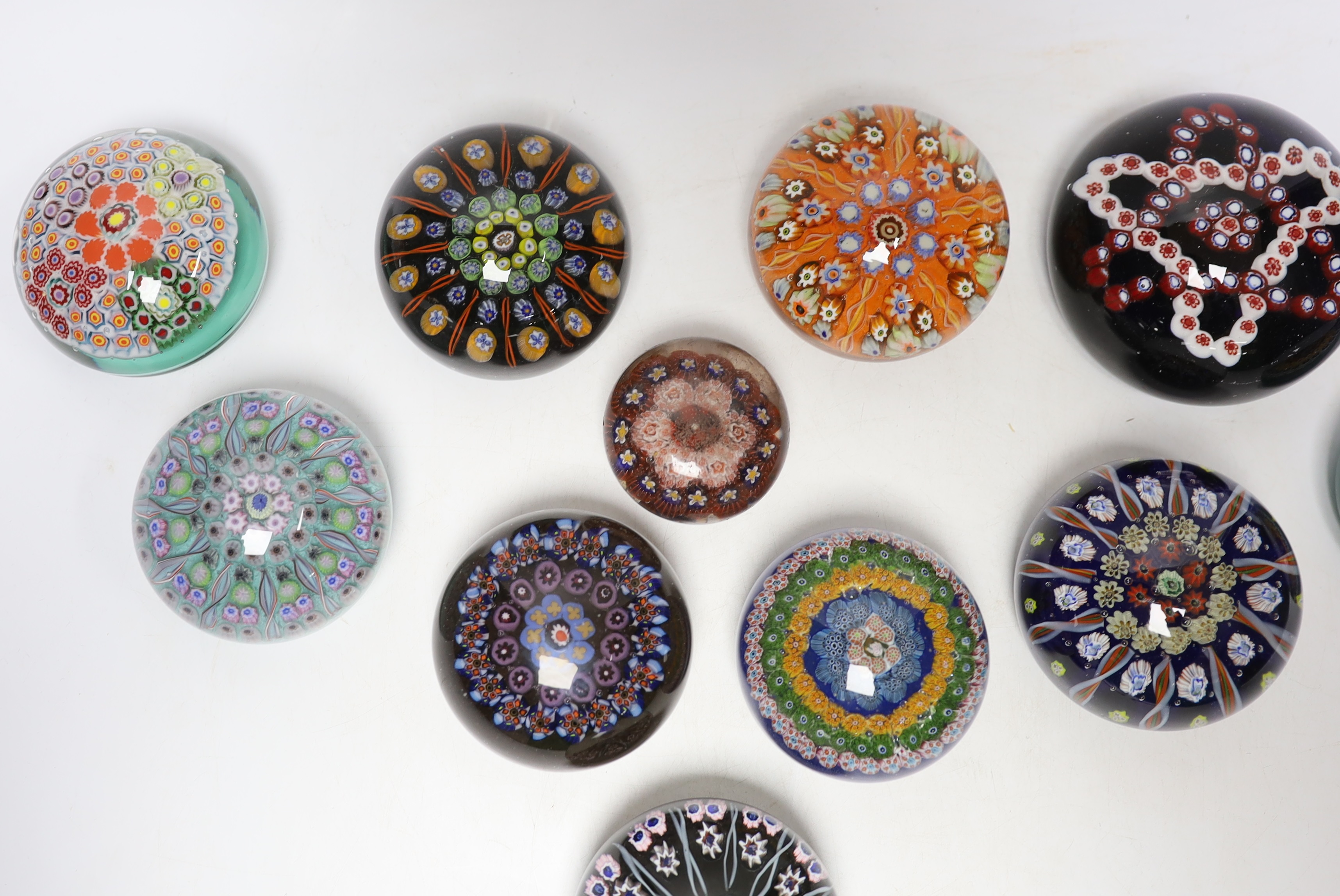 Twelve various mixed glass paperweights